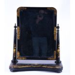 A 19th century black lacquer toilet mirror with gilt and polychrome painted floral decoration, 59 cm