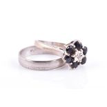 An 18ct white gold and sapphire floral cluster ring size L 1/2, together with a white metal band