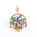 Cartier, London. A giardiniera brooch in the form of a basket of flowers, set  with white and