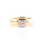 A yellow gold and diamond ring the white metal squared mount inset with a round brilliant-cut