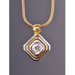 An 18ct yellow and white gold and diamond pendant of chamfered squared form, the stepped mount inset