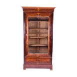 A late Victorian mahogany glazed bookcase with large central glazed door enclosing shelves, with