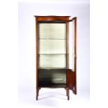 A turn of the century inlaid vitrine display cabinet with serpentine front and curved glass panel