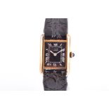 A Must de Cartier Tank silver gilt ladies wristwatch the black dial with silvered Roman numerals,