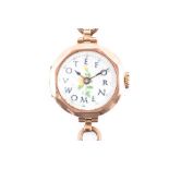 A 9ct gold cased Suffragette watch with central enamel dial reading 'Vote for Women' with yellow