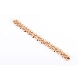 An 18ct yellow and rose gold French bracelet circa mid to late 20th century, comprised of rounded