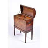 A George III flame mahogany cellarette with domed top opening to a fitted interior with top