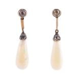A pair of opal and diamond drop earrings the yellow metal mounts each inset with an old-cut