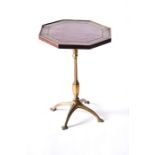 A Victorian octagonal brass inlaid occasional table with central octagonal tooled leather within