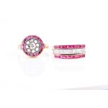 An early to mid 20th century diamond and ruby target ring centred with an old-cut diamond within a