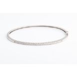 A diamond bangle set with round brilliant-cut diamonds of approximately 0.75 carats combined, the