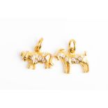 A yellow metal novelty charm set with diamonds, in the form of a goat, 13 mm long, together with a