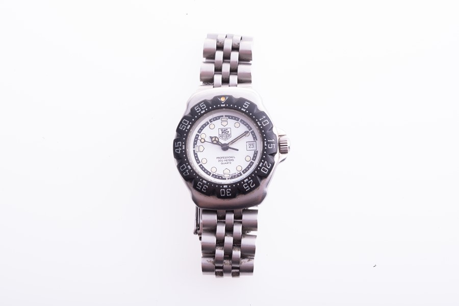 A Tag Heuer Professional Formula 1 ladies stainless steel wristwatch the white dial with roundel