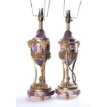 A pair of Louis XVI style marble and ormolu mounted lamps each modelled as cassolettes with finely