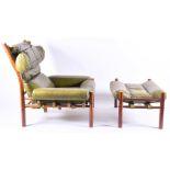 A green leather upholstered chair and footstool in the manner of Percival Lather or Arne Norell with
