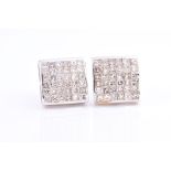 A pair of 9ct white gold and diamond earrings of square form, each inset with thirty six calibre-set