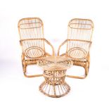 A 1970's bamboo garden set comprising two curved armchairs with ratan, together with a matching