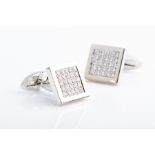 A pair of diamond cuff links the square mounts pave-set with round brilliant-cut diamonds of