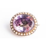 An early to mid 19th century amethyst brooch the large faceted amethyst with foil backing, within
