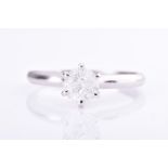 A solitaire diamond ring set with a round-brilliant cut diamonds of approximately 0.60 carats,