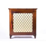 A Regency rosewood side cabinet with single cupboard with brass lattice grill and silk backing,