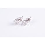 A pair of solitaire diamond ear studs set with round brilliant-cut diamonds of approximately 0.46