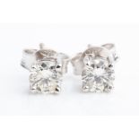 A pair of round brilliant-cut diamond ear studs the stones of approximately 0.70 carats combined,