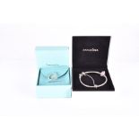 Tiffany & Co. A silver ring with a heart-shaped motif, size K, in original gift bag and box,