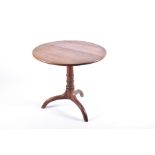 A 19th century oak tilt-top occasional table on turned column and tripod base, 75 cm diameter x 68
