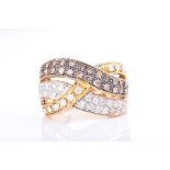 A yellow metal, white and cognac diamond cocktail ring of triple-band crossover style, inset with