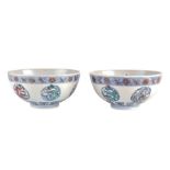 A pair Chinese of porcelain doucai 'dragon' bowls late 19th/early 20th century, with hand-painted