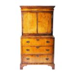 A William & Mary period mahogany and walnut cabinet on chest formed of a chest of three drawers