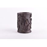 A 19th century Chinese bamboo brush pot  the small formed pot is decorated with figures carved in