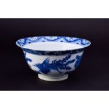 A late 17th / early 18th century Chinese blue and white porcelain bowl decorated with flying