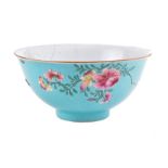 A Chinese turquoise ground famille rose porcelain bowl with painted blossom decoration, blue