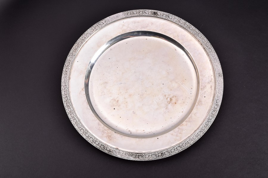 A 20th century Italian silver platter by Faccioli, Milan, of circular form, the borders decorated