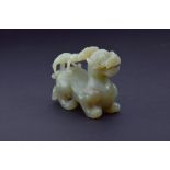 A late 19th / early 20th century Chinese jade carving modelled as a mythical guardian, possibly