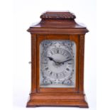 An early 20th century oak cased bracket clock with non-striking movement, the silvered dial