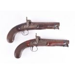 A matching pair of 19th century percussion pistols with 15.5 cm hexagonal barrels, walnut stocks and
