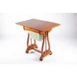 An early 20th century sewing and games table rectangular top section opens to reveal a games table