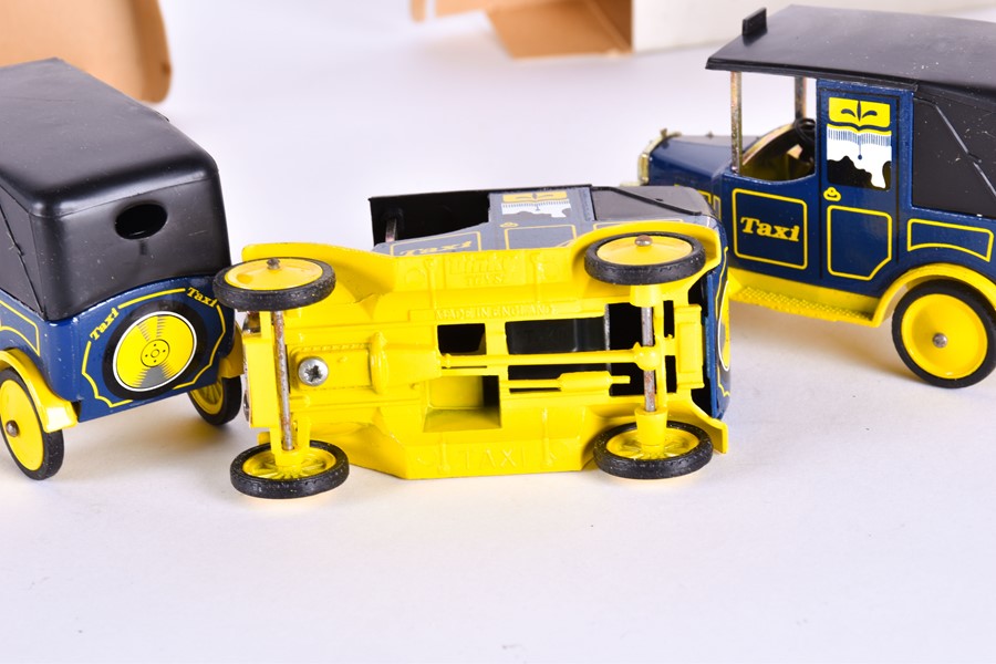 A collection of 57 boxed Dinky Toys Taxi models each modelled in blue and yellow, cast to the - Image 3 of 12