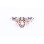 A late 19th century yellow gold, diamond, and pearl bee brooch the head and thorax inset with a grey