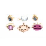 An 18ct yellow gold and amethyst ring set with a mixed rectangular-cut amethyst, with small