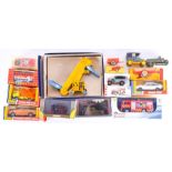 A collection of mixed Dinky Toys diecast models comprising a boxed 320 Harvest trailer, a boxed