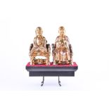 A pair of early 20th century Chinese ceramic religious figures modelled as the two religions of