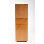 An unusual contemporary Modernist style cupboard with three drop-down doors, of stacked cube form