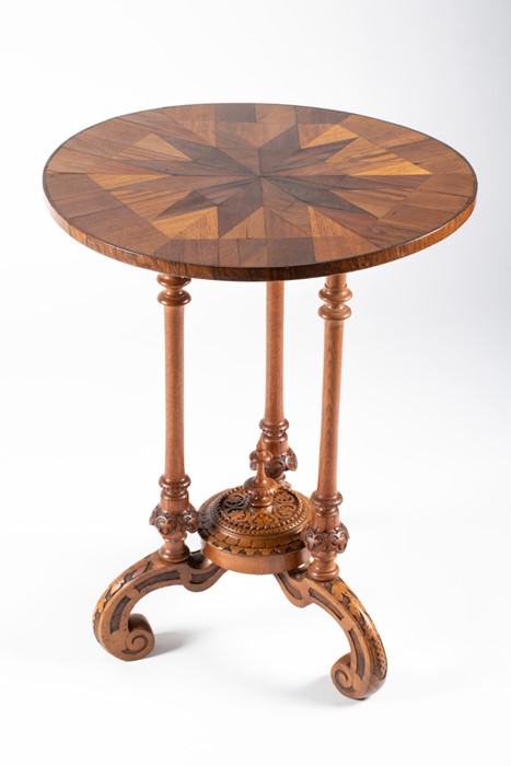 An early 19th century English specimen wood occasional table of circular form with inlaid