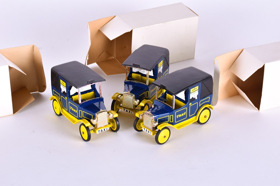 A collection of 57 boxed Dinky Toys Taxi models each modelled in blue and yellow, cast to the - Image 8 of 12