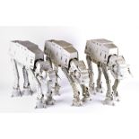 Three original Star Wars AT-AT vehicles all unboxed, one lacking cockpit cover. (3)CONDITION