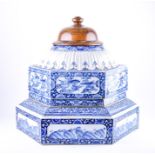 A 19th century Chinese blue and white ceramic pagoda composed of three sections, the hexagonal